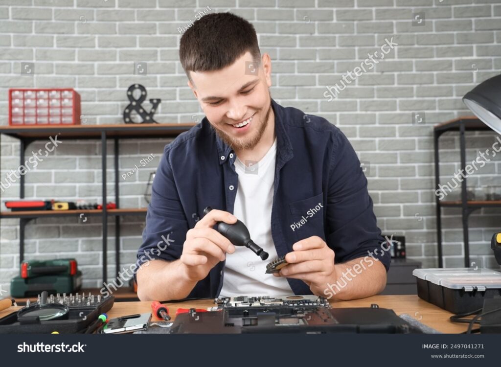 MAN DOING LAPTOP SERVICES