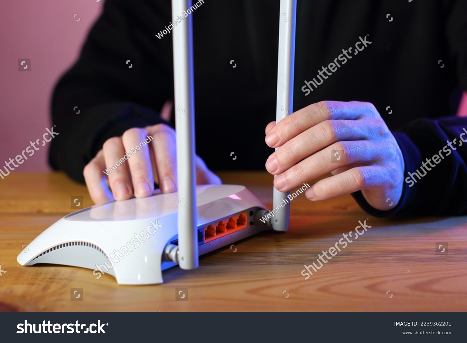 Person holding router